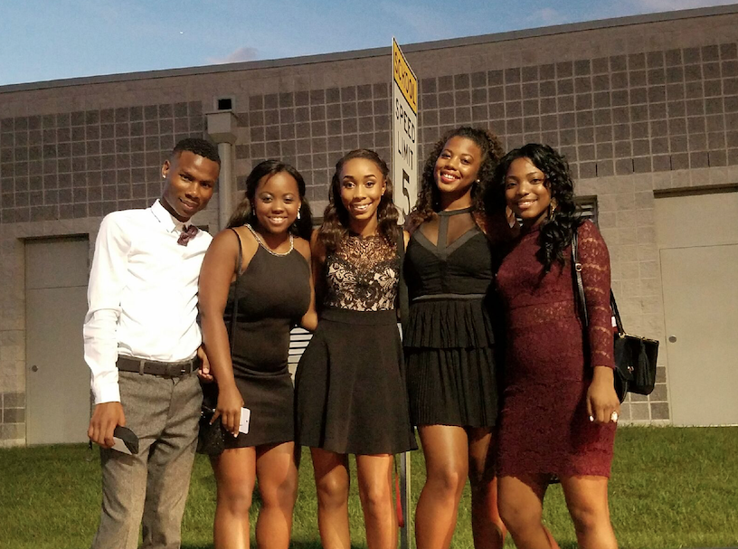 Keeana Harris and friends Jovawn, Tyanah, Siara, and Amari pose for a picture before Homecoming dance. 