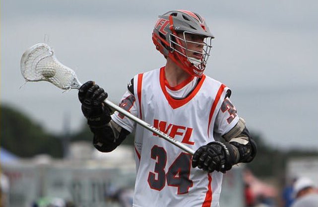 Junior Jeremy Handman, looking for an open man during a lacrosse game.