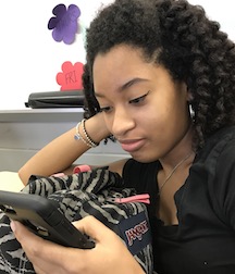Sophmore, Noella on twitter searching through recent tweets.