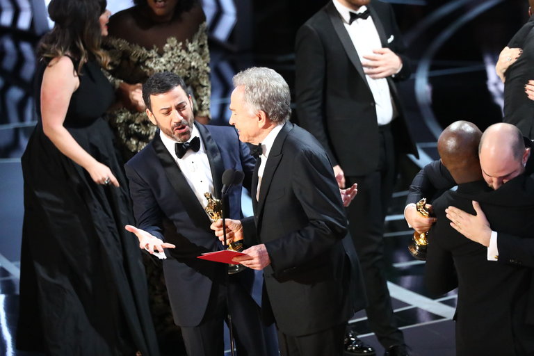 Jimmy Kimmel, left, and Warren Beatty onstage at the Academy Awards in Los Angeles on Sunday night. Credit Patrick T. Fallon