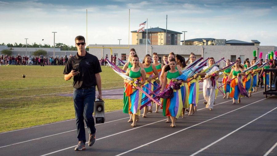 Duncan leading the band into the bleachers at a 2016 football game