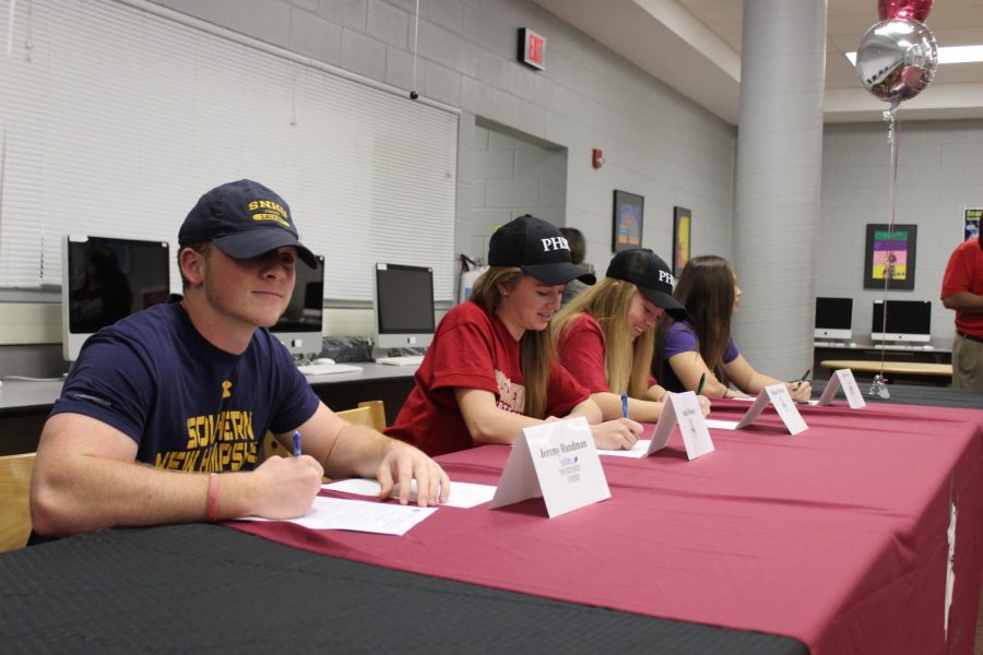 All+the+athletes+signing+to+their+future+school.