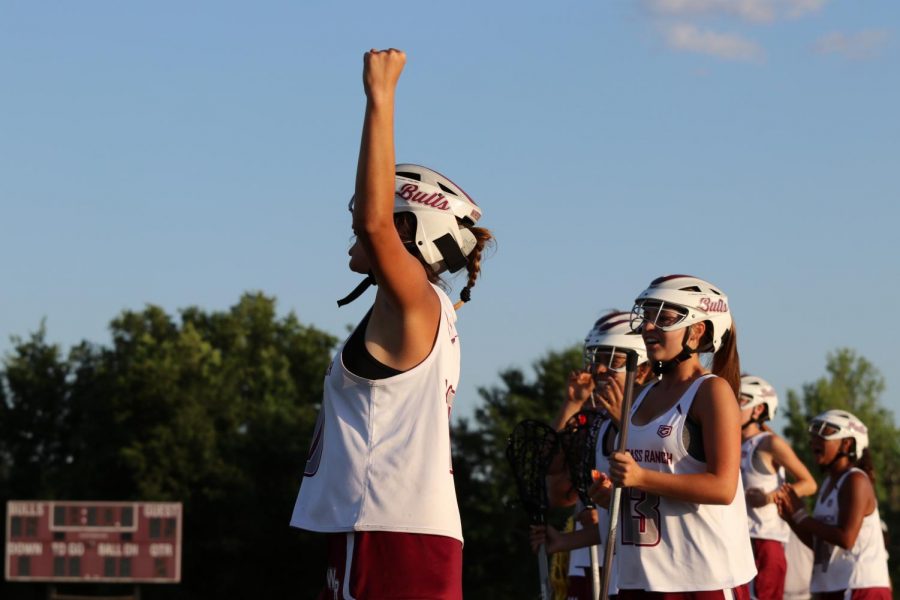 Wiregrass girls lacrosse celebrating a goal. 