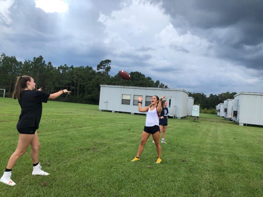 Seniors+Jordyn+Beer+and+Emily+Beazley+warming+up+their+throws+at+practice+Tuesday.