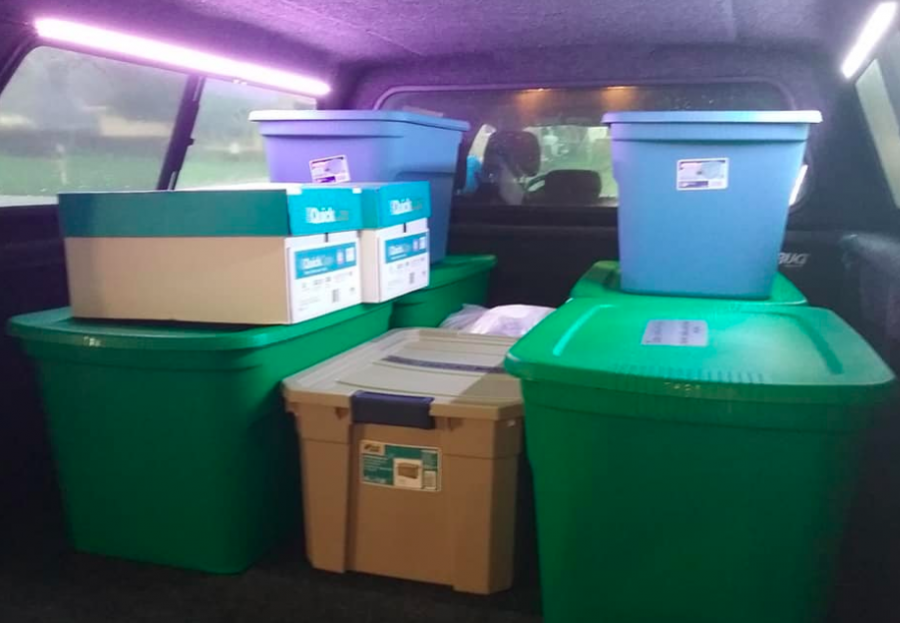 Donation bins in the back of truck.