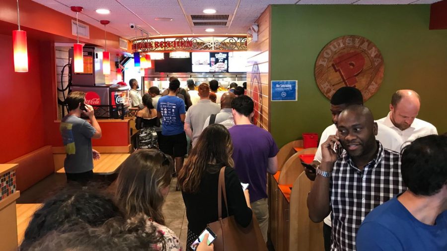 People waiting in line to get the Popeyes chicken sandwich