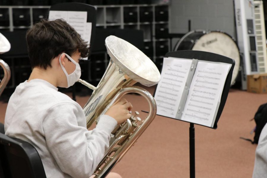 Wiregrass band student practices his instrument while following CDC health guidlines.