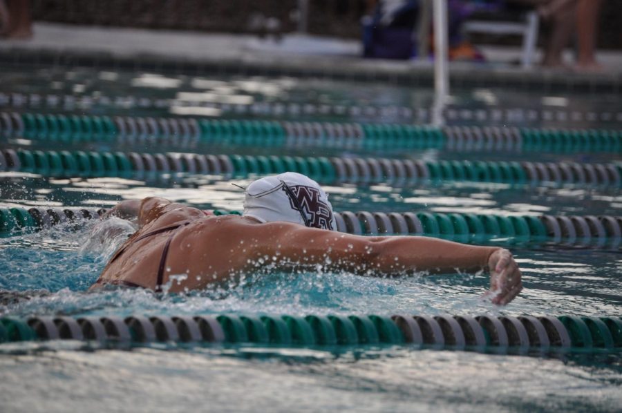 Salas swimming the breaststroke heat against River Ridge High School.