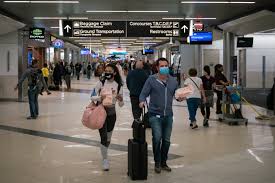 People going through the airport during Thanksgiving week during 2020.