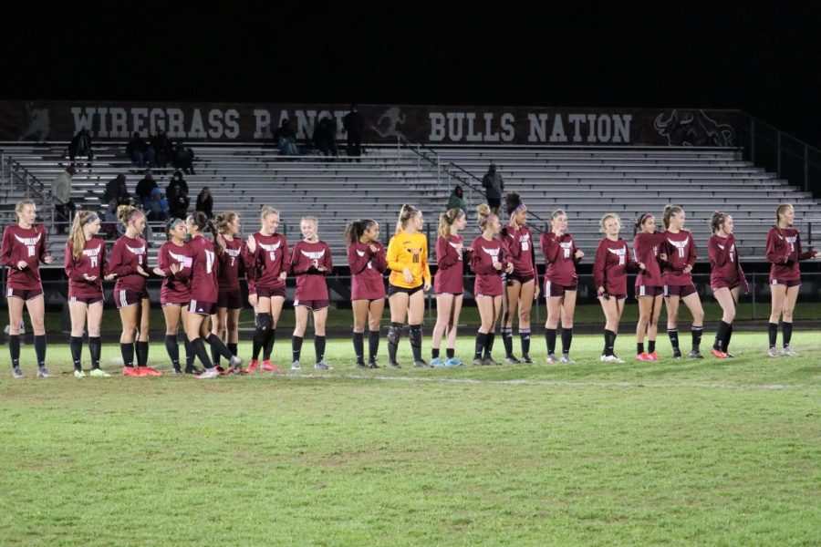 Wiregrass Girls Soccer lining up together before kickoff last season.