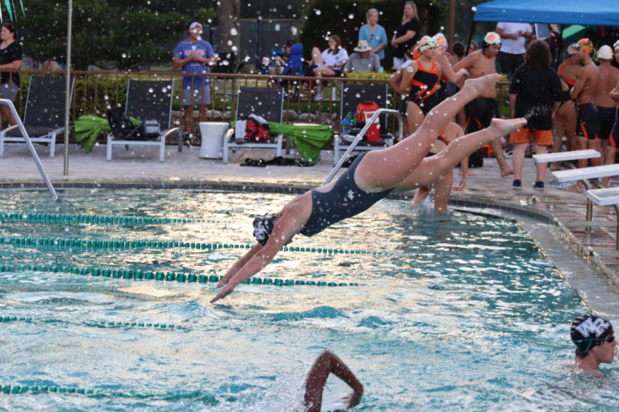 Girl swimmer Brooke Beathler diving into the water after the whistle was blown.