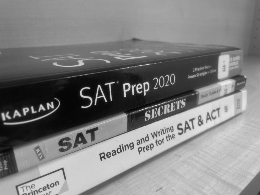 SAT and ACT prep books are pictured, which give certain students a higher advantage over others who cant afford such resources.