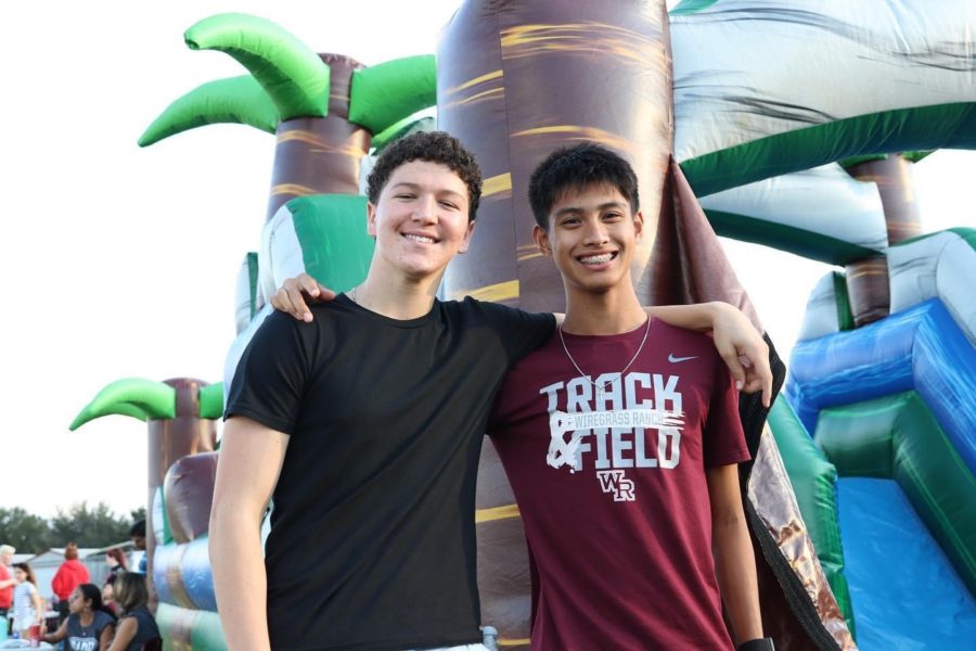 Juniors Xander Grant and Kaden Manalo pose after a race in the obstacle course.