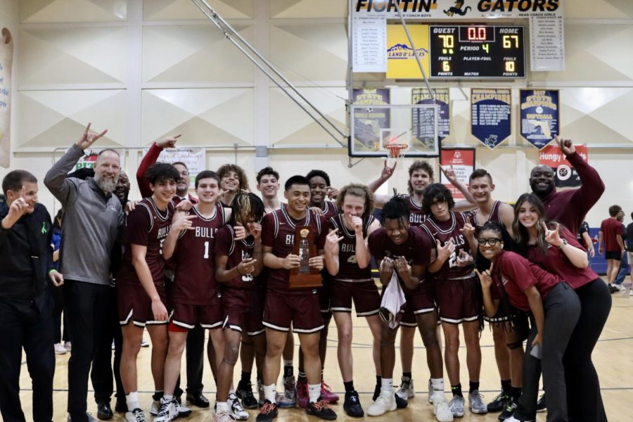 Wiregrass+Ranch+High+School+boys+basketball+team+posing+with+the+district+championship+trophy+after+their+win+against+Mitchell+High+School.