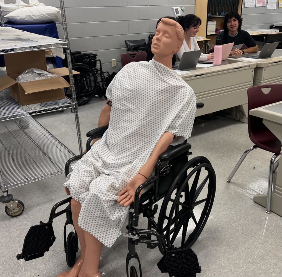 One of the CNA programs mannequins posed in a wheelchair.