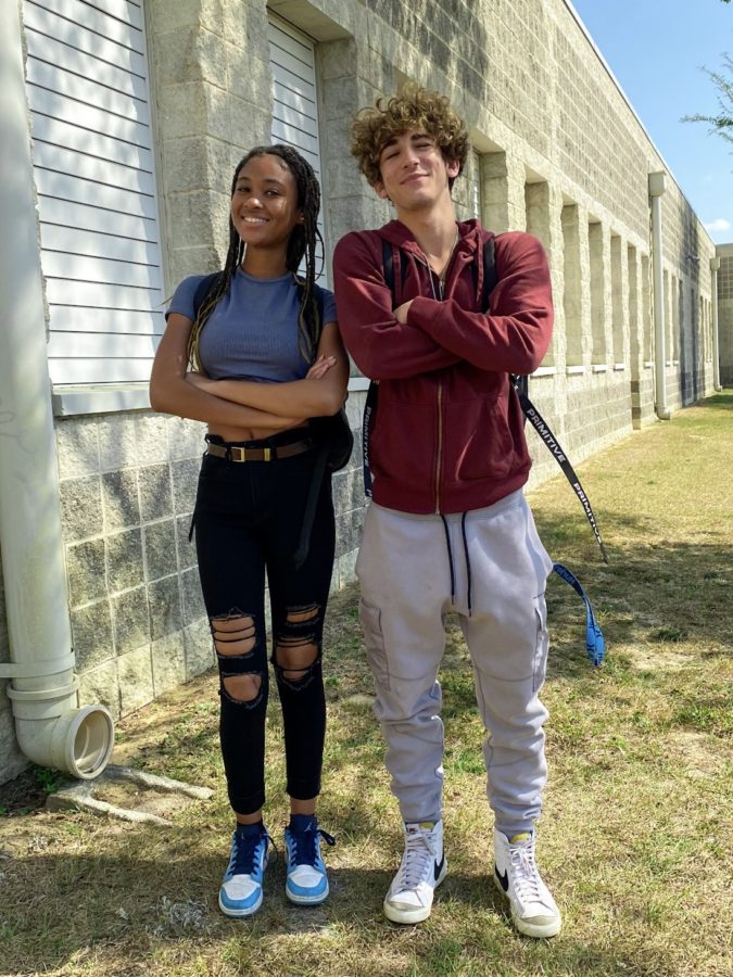 Seniors Destini Pope and Evan Cayer pose outside of Wiregrass.